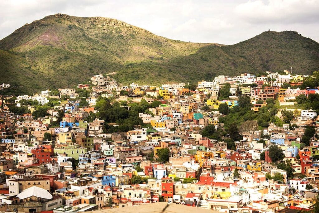 Panoramic view of colorful hillside homes in Guanajuato City Mexico