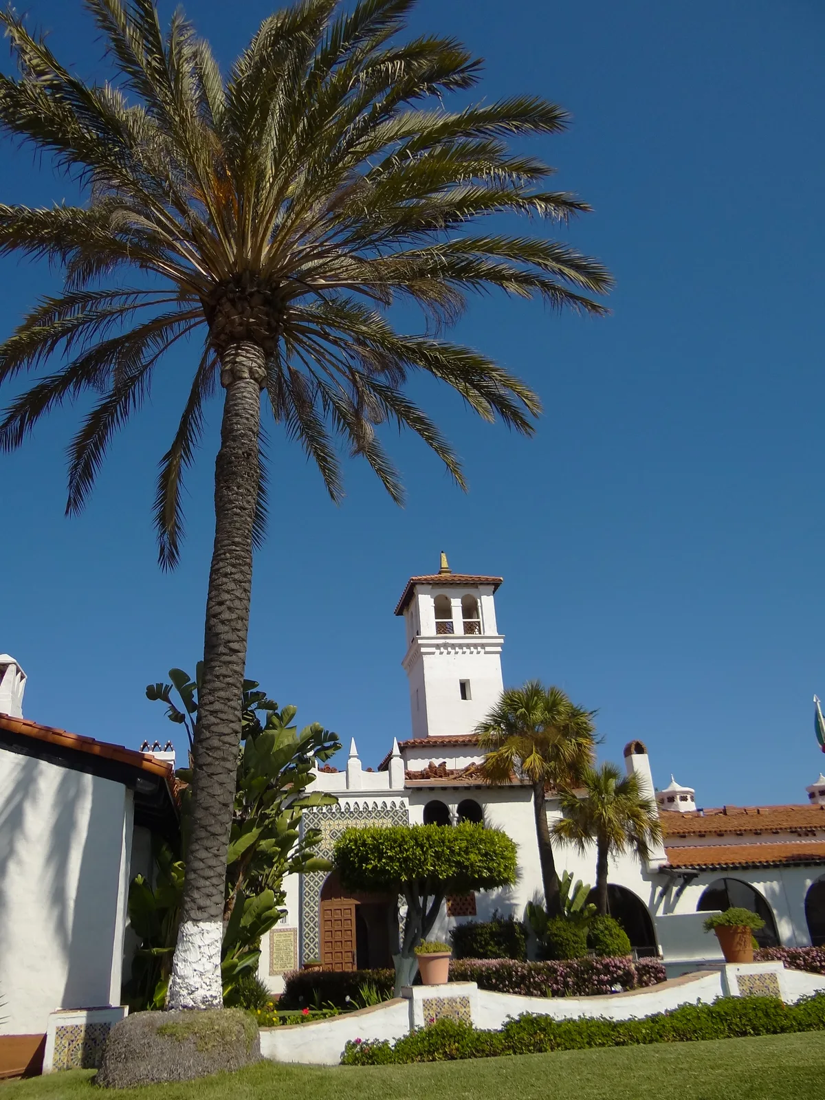White tower, palm trees and gardens at the Riviera cultural center in Ensenada